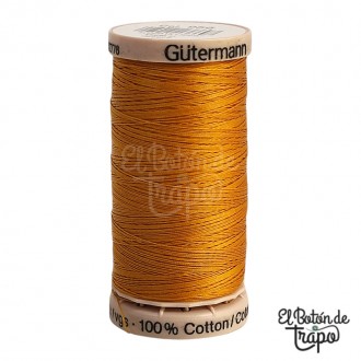 Hilo para acolchar a mano encerado Gütermann naranja.